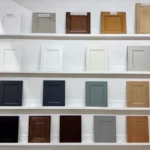 Cabinet door samples in various colors and styles displayed on showroom shelves | Jabara's