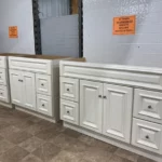 White bathroom vanity cabinets with raised panel doors and drawers | Jabara's