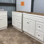 White bathroom vanity cabinets with raised panel doors and drawers | Jabara's